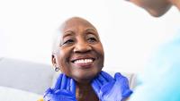 Patient's lymph nodes being checked by doctor